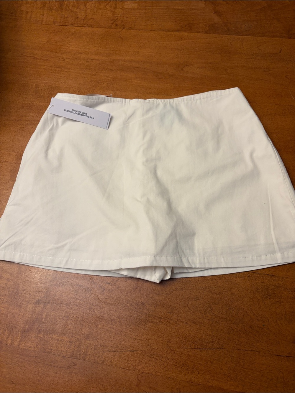 Princess Polly white low rise Gigi skort.